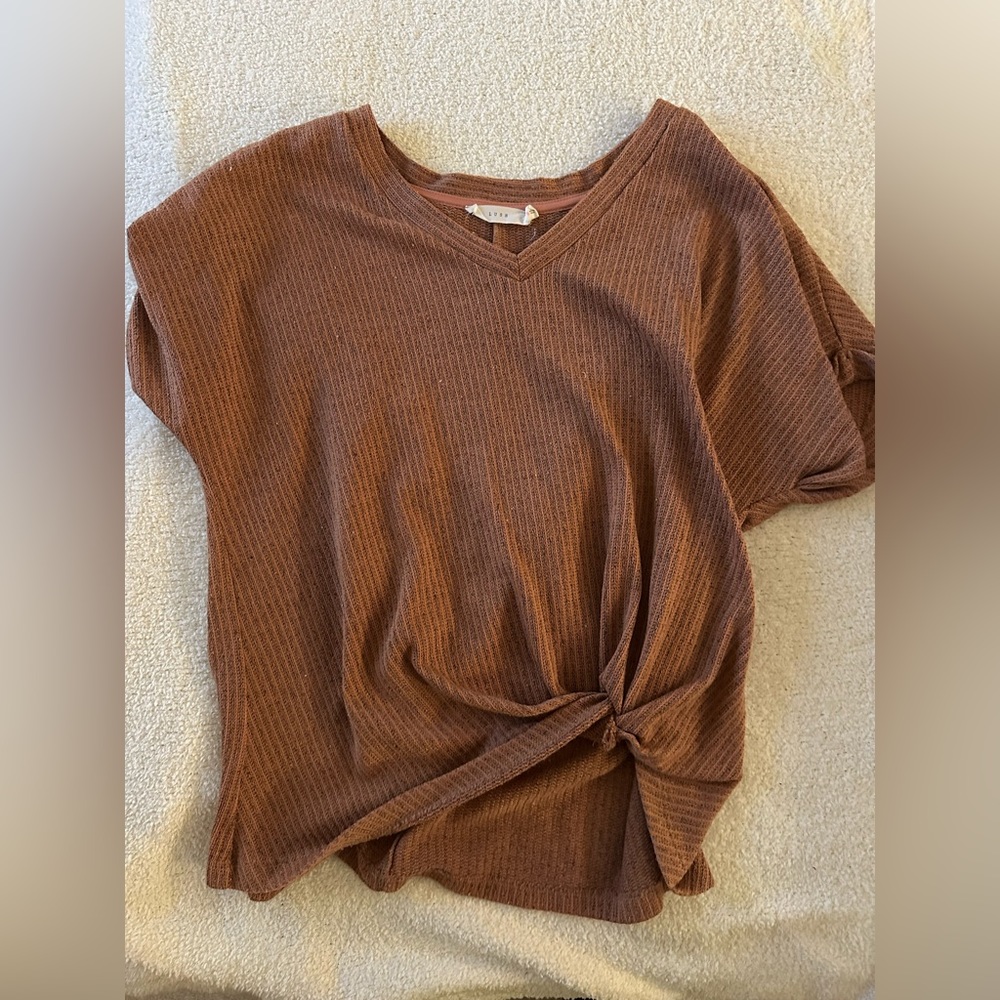 red/brown top with tie